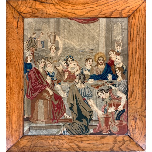 330A - A 19th century Biblical needlework tapestry depicting The Wedding Feast at Cana, in an oak frame, 53... 