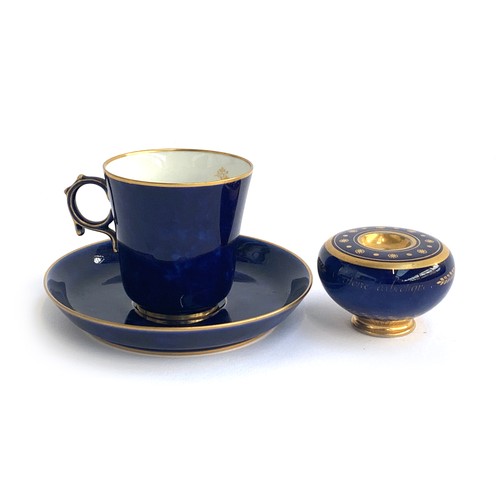 290 - An early 20th century Sevres porcelain teacup and saucer, cobalt blue heightened in gilt, marked to ... 