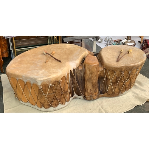 713 - A double trunk cottonwood drum, covered in buffalo hide, purchase in Taos, New Mexico, approximately... 