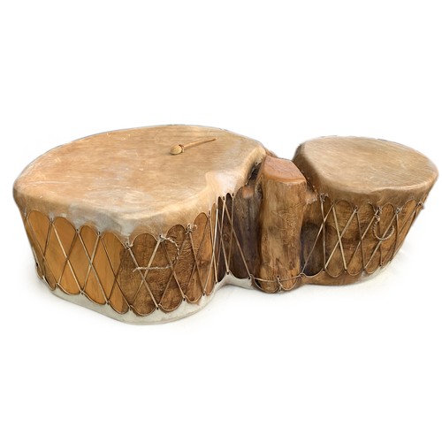 713 - A double trunk cottonwood drum, covered in buffalo hide, purchase in Taos, New Mexico, approximately... 