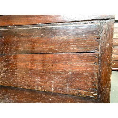 589 - A George II oak dresser base, moulded top over three inlaid and crossbanded drawers, shaped apron, a... 