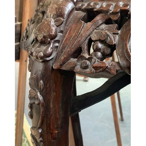 629 - A Chinese carved hardwood and marble inset jardinière stand, 95cm high