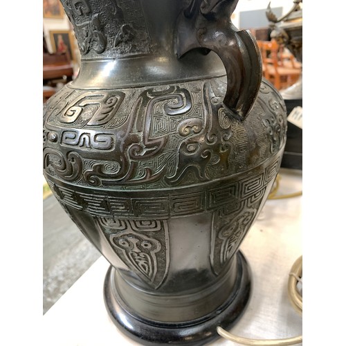 258 - A Chinese bronze vase, decorated with archaic stylised animals, fitted for electricity, 32.5cm high ... 