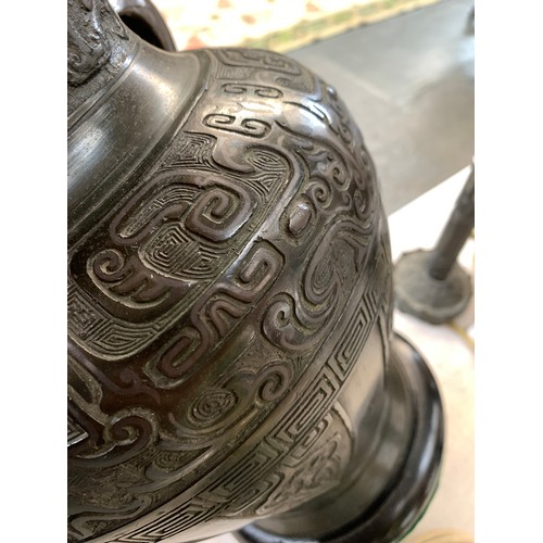 258 - A Chinese bronze vase, decorated with archaic stylised animals, fitted for electricity, 32.5cm high ... 