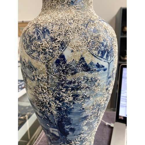 262 - A large Chinese blue and white urn, recovered from a shipwreck, with panels depicting flora and land... 