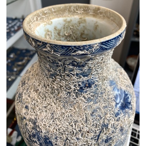 262 - A large Chinese blue and white urn, recovered from a shipwreck, with panels depicting flora and land... 