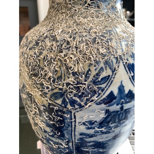 262 - A large Chinese blue and white urn, recovered from a shipwreck, with panels depicting flora and land... 