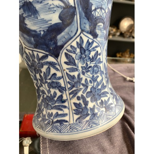 262 - A large Chinese blue and white urn, recovered from a shipwreck, with panels depicting flora and land... 