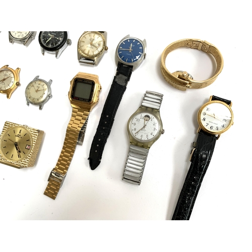 115 - A mixed lot of various wristwatches and faces to include a Swatch automatic, Seiko, Corvette, Timex,... 