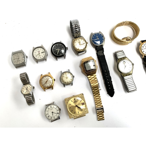 115 - A mixed lot of various wristwatches and faces to include a Swatch automatic, Seiko, Corvette, Timex,... 