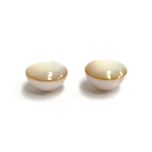 9 - A matched pair of loose Mabe pearls, each approx. 1.8cmD