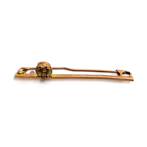 22 - A 9ct gold bar brooch in the form of an owl on a branch, approx. 2.3g