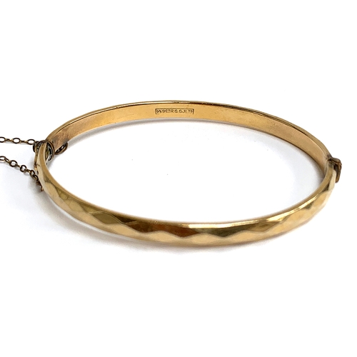 25 - A Georg Jensen 1/5 9ct rolled gold bangle, with safety chain, approx. 15.2g, 7cmD