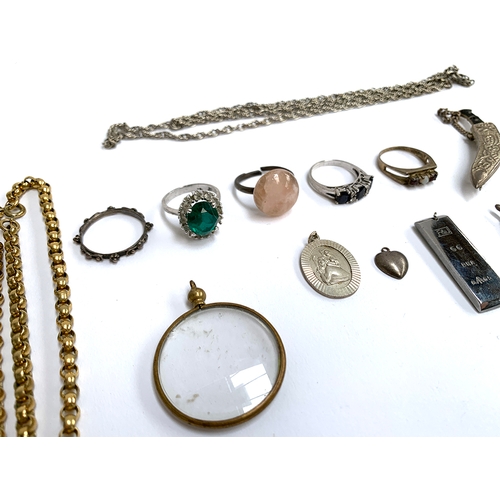 45 - A quantity of jewellery to include silver pendants and chains; white metal chain; gilt metal belcher... 