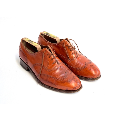 780 - A pair of Maxwell brown leather semi brogues, size 8, with trees, with a pair of blue shoe bags