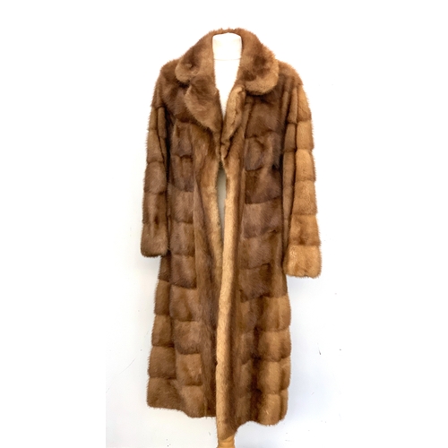 712 - A ladies fur coat, approx. size 10