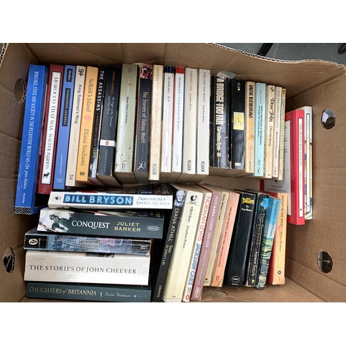 266 - Two boxes of paperback books to include Conn Igguldon, Dickens, Hilary Mantel, Joseph Conrad, Keroua... 