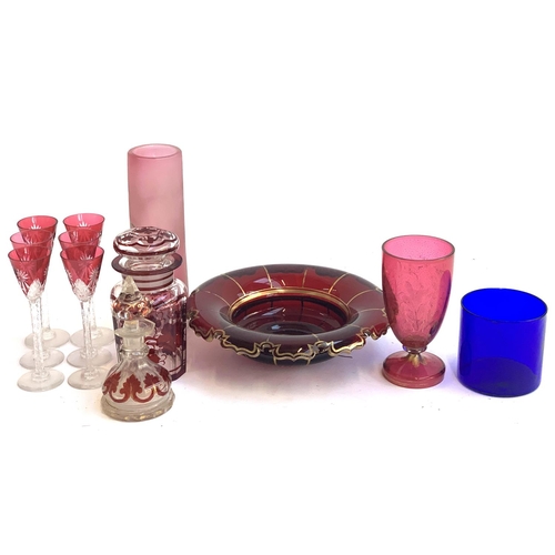 137 - A small lot of mostly cranberry glass to include a set of 6 cordial glasses, rummer decorated in gil... 