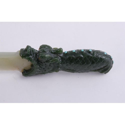 318 - A pair of jadeite models of daggers, 20th century, the spinach green handles carved as dragons with ... 