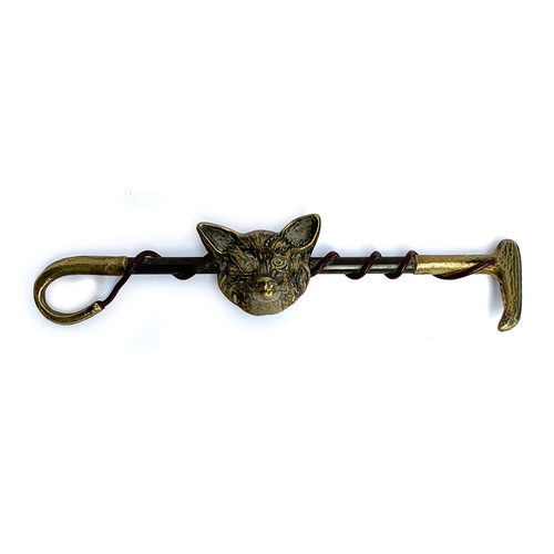 158 - A decorative brass hunting whip with fox mask, 32cm long, together with a small print of huntsmen an... 