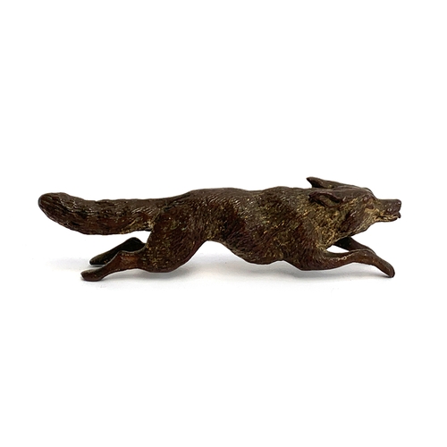 105 - A cold painted bronze of a running fox, 11.5cm long