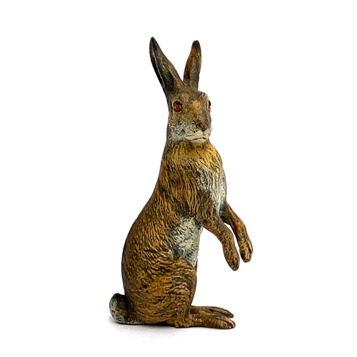 106 - A cold painted bronze of a hare, 10.5cm high (2 threaded holes to underside)