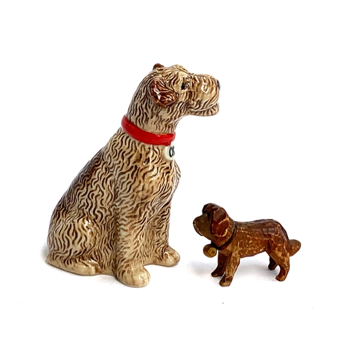 162 - A small carved wooden St Bernard in the style of Forest Toys, 5.5cm long, together with a ceramic Te... 