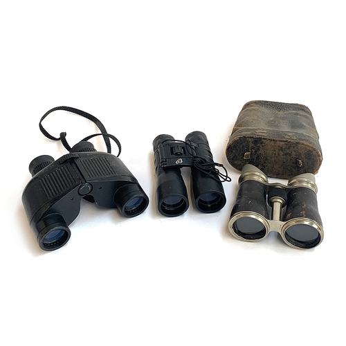 565 - A pair of vintage binoculars in leather case; together with two other pairs (3)