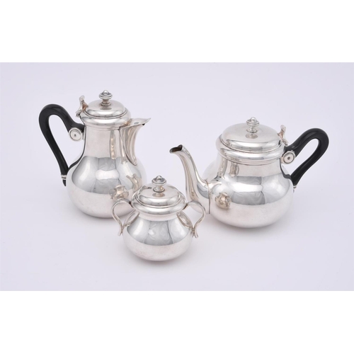 79 - A French electro plated three piece baluster tea set, Christofle 1935-1983 mark, the tea and hot wat... 