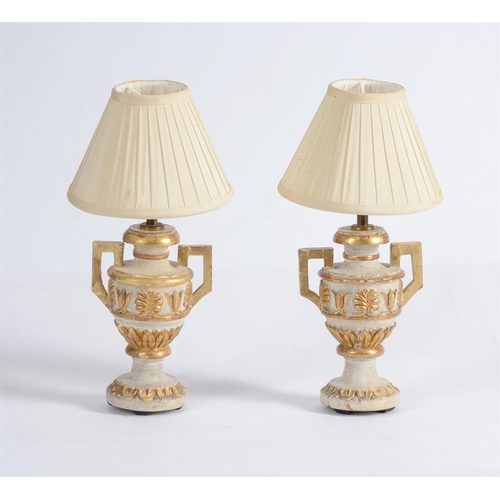 327 - A pair of modern turned and carved wood urn table lamps, cream painted and parcel gilt, 32cmH to top... 