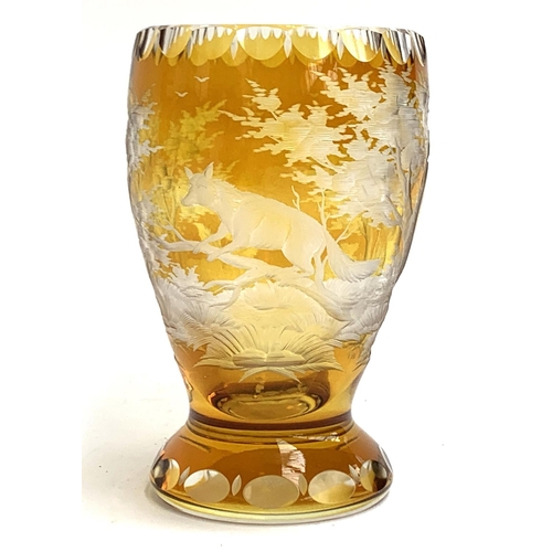 193 - An amber Bohemian glass, etched with fox, initialed NS and numbered 16/500