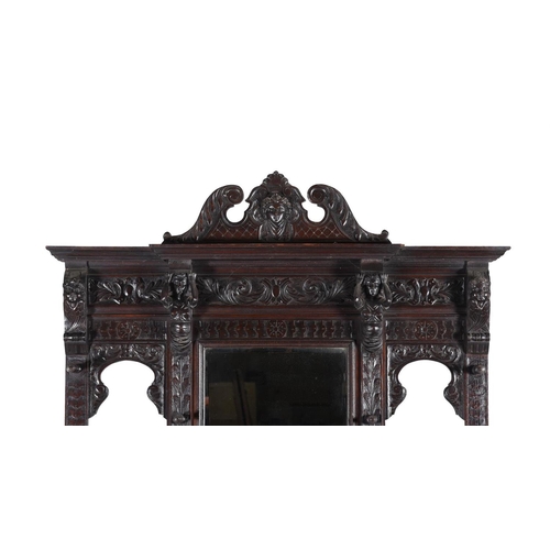 923 - A carved oak hall stand in antiquarian taste late 19th or early 20th century with ivorine label to t... 