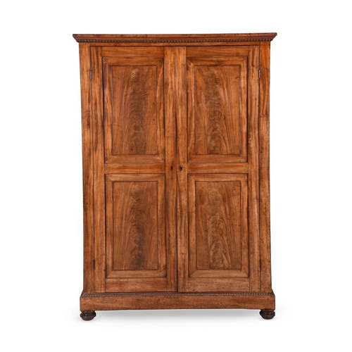 922 - A mahogany cupboard, early 19th century, 170cm high 108cm wide, 60cm deep 

Provenance: Lockerley Ha... 