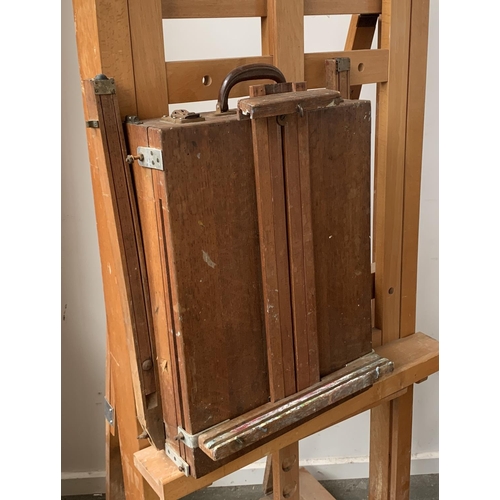 924 - A very large beechwood artists studio easel; together with a further portable easel