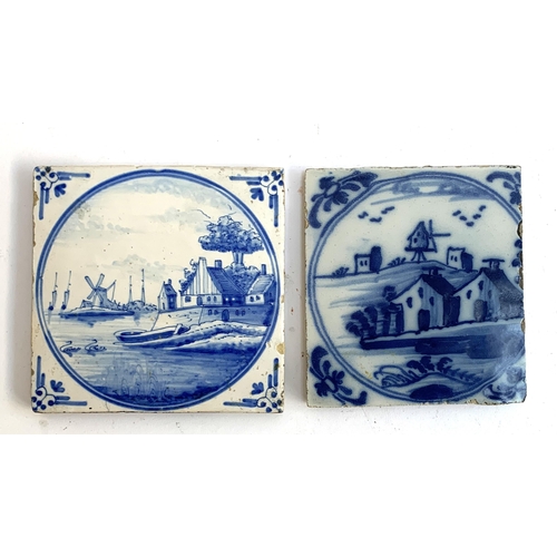 144 - Two 18th/19th century Dutch Delft tiles of village scenes, one with sailing boats & barge