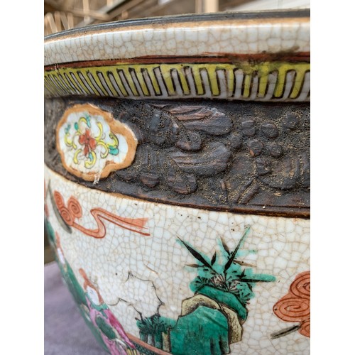 167 - A large Chinese crackle glazed stoneware and polychrome enamel fish bowl, the outside decorated with... 