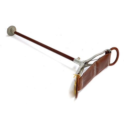 65 - An aluminium and leather shooting stick, 87cmL