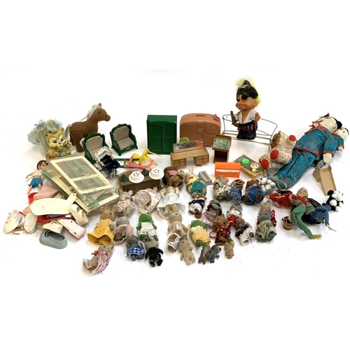 1196 - A quantity of toys, figures and dolls to include Sylvanian families, Polly Pocket etc