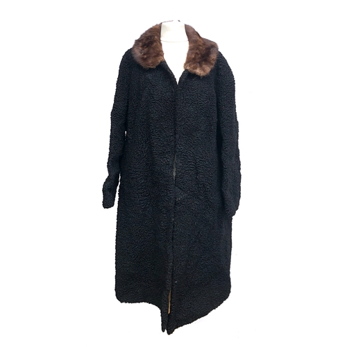 751 - A ladies black astrakan coat, with fur collar