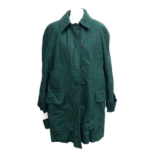 752 - An Aquascutum green wool ladies shooting coat with red lining