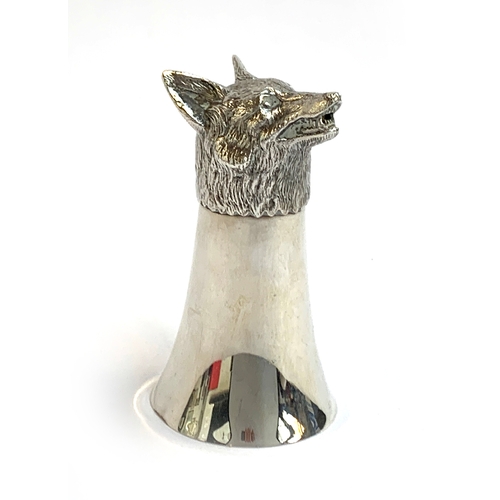 97 - A silver fox head stirrup cup, Gibson & Co Ltd, London 1978, of flared plain beaker form, with a rea... 