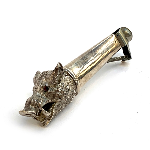 163 - A late 19th century silver cigar cutter, probably Austrian, the end modelled as a wild boar's head, ... 