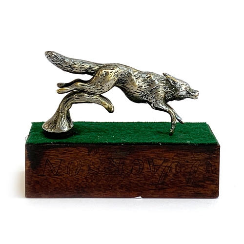 120 - A Desmo car mascot modelled as a leaping fox, approx. 11cm long, mounted on a mahogany base