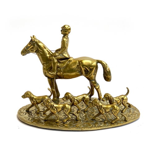 125 - A cast brass figure group of a huntsman and hounds, 18.5cm high