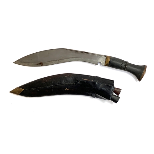 696 - A Nepalese khukri knife, complete with the Karda and Chakmak knives, in leather scabbard, the blade ... 