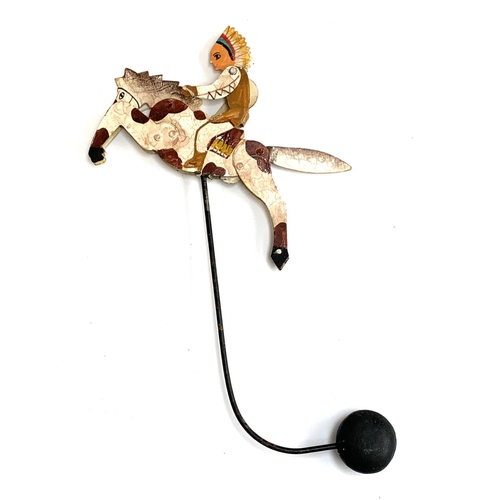 1320 - A metal balance toy in the form of a Native American on a leaping horse, without stand, 43cmH