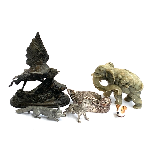 136 - Several white metal figures to include fox; dog; waterfowl; a spelter cast figure of a jackdaw; etc