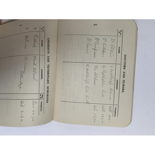 702 - An air raid warden's reference book with entries and hand drawn map, together with an air raid preca... 