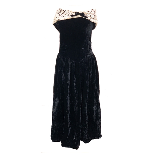 765 - A vintage ball gown; together with one other in green; a black velvet evening dress with lace collar... 