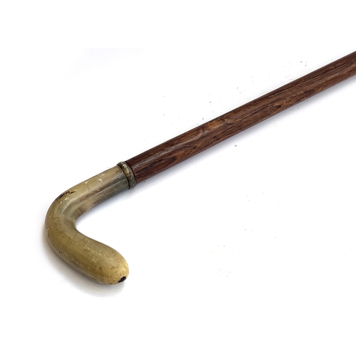 60 - A walking cane with shaped horn handle